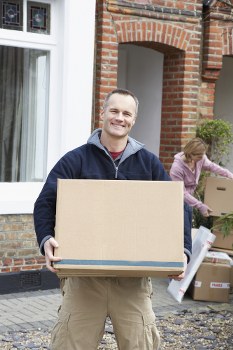 Man with a van service in Pentonville loading household items carefully