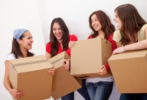 Professional movers packing household items for a Pentonville relocation