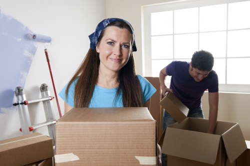 Removal van and movers unloading belongings for a Pentonville flat relocation