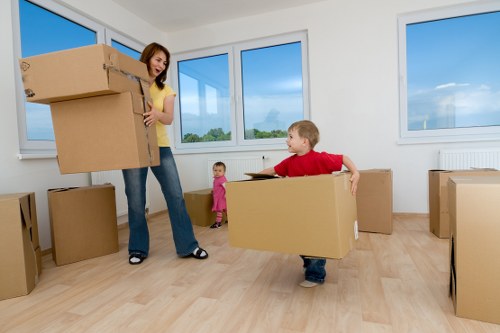 Packed moving boxes and furniture ready for transport in Pentonville